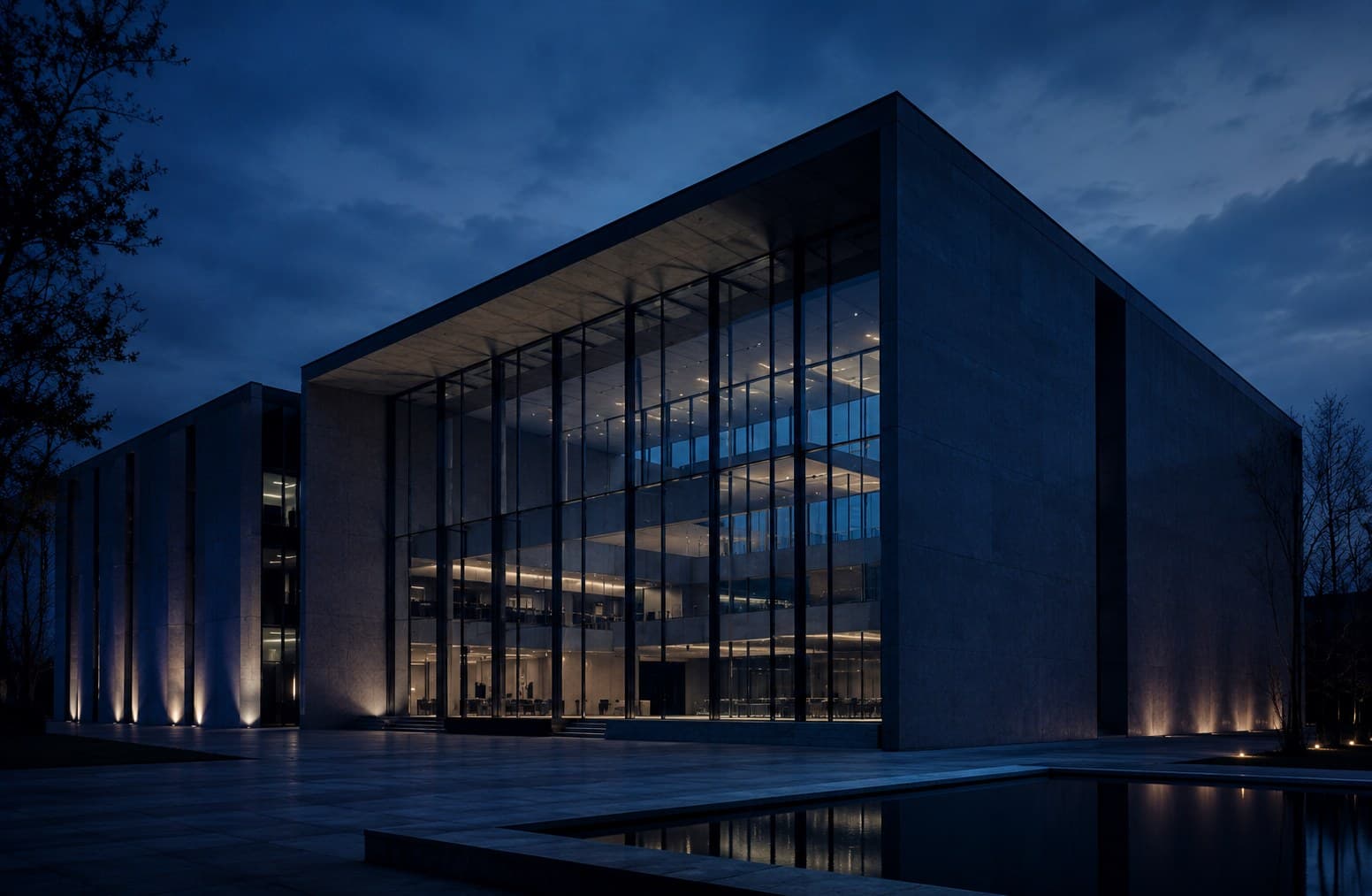 Modernist headquarters at dusk — the institutional substrate of private and family-led enterprise.